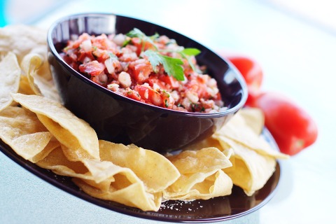 Salsa and chips can be a festive snack or appetizer to share with friends and family.